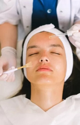 Woman receiving a chemical peel treatment